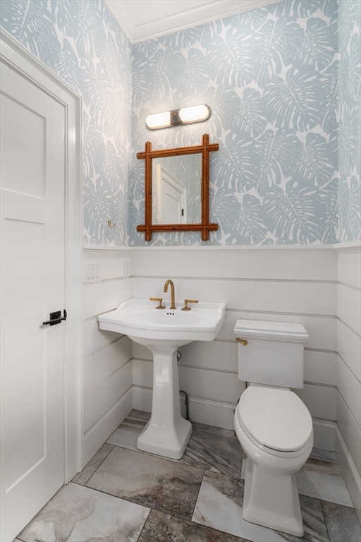 11 Fisher Avenue Wellesley, MA 02482 - Photo 12 of 35 a bathroom with a sink a toilet and mirror