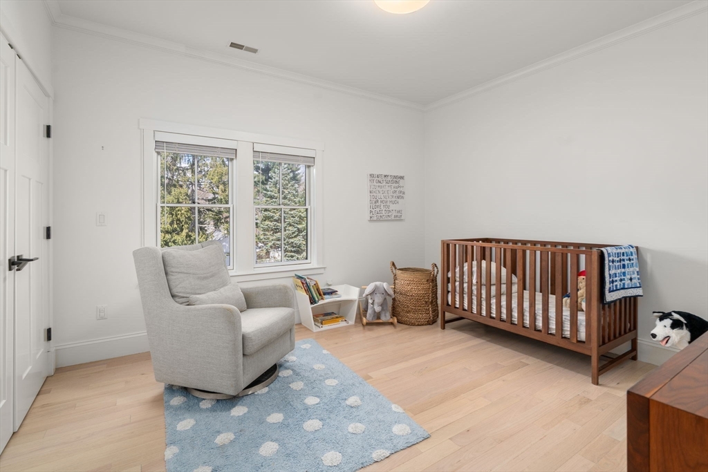 11 Fisher Avenue Wellesley, MA 02482 - Photo 22 of 35 a bedroom with furniture and a large window