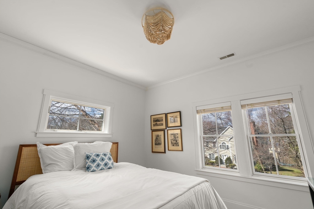 11 Fisher Avenue Wellesley, MA 02482 - Photo 24 of 35 a bedroom with a large window and a bed