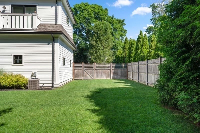11 Fisher Avenue Wellesley, MA 02482 - Photo 34 of 35 a view of a backyard with plants and large trees