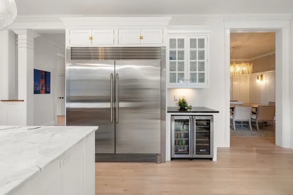 a kitchen with stainless steel appliances granite countertop a stove and a refrigerator