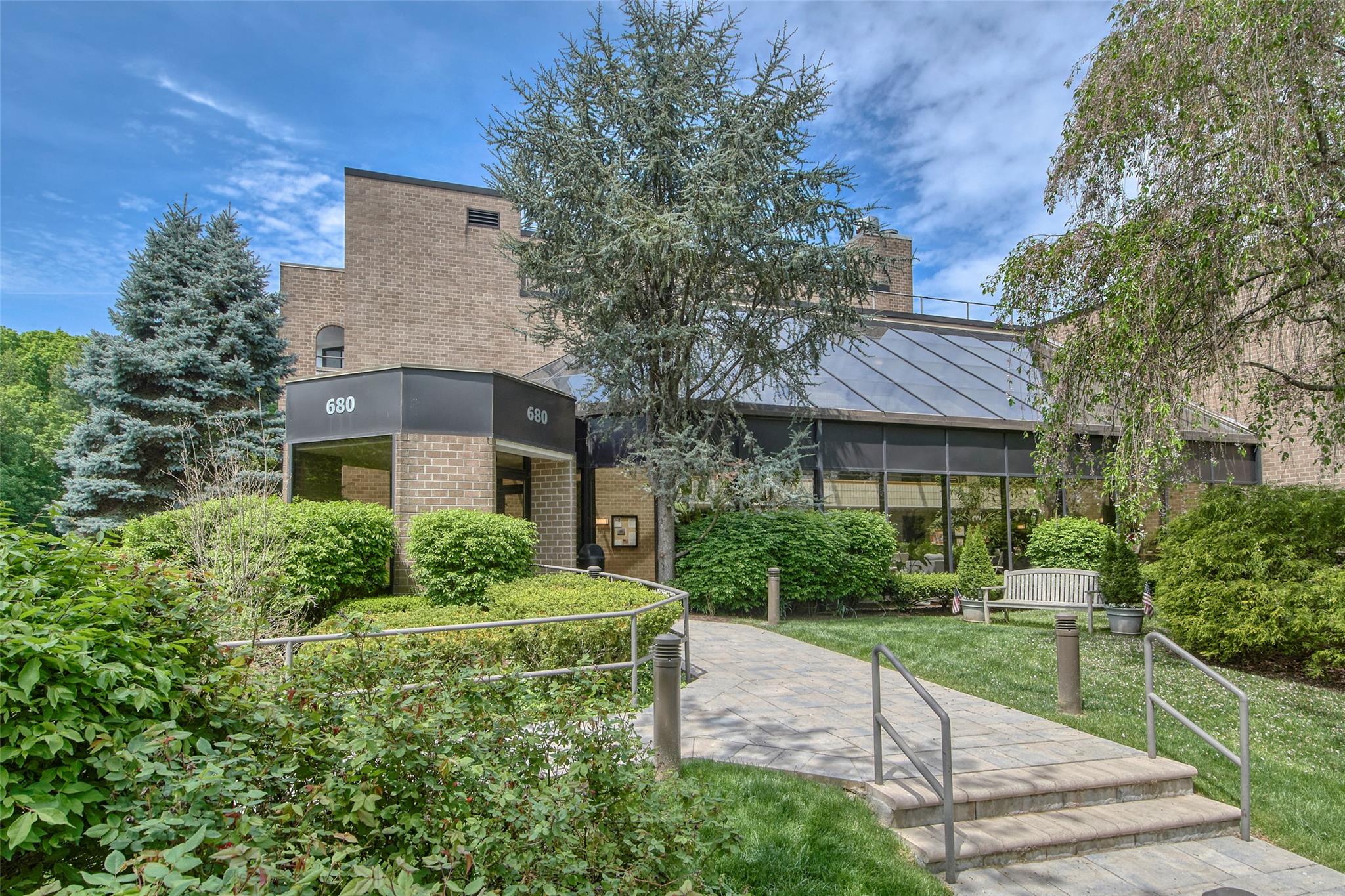 680 West Boston Post Road, Unit 3R Mamaroneck, NY 10543 - Photo 1 of 1 a view of a brick house with a yard