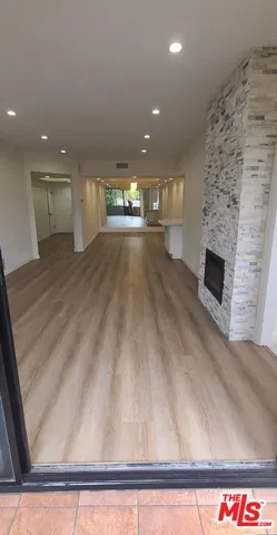 a stove top oven sitting inside of a kitchen