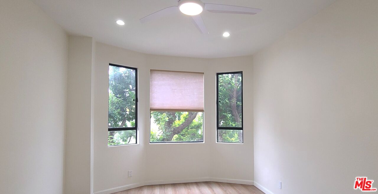 1557 South Beverly Glen Boulevard, Unit 104 Los Angeles, CA 90024 - Photo 32 of 44 a view of empty room with window