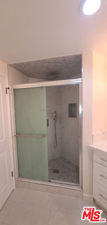 1557 South Beverly Glen Boulevard, Unit 104 Los Angeles, CA 90024 - Photo 41 of 44 a bathroom with a shower