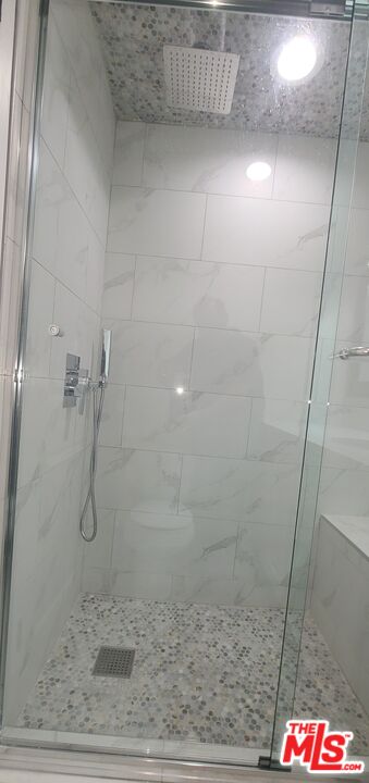 1557 South Beverly Glen Boulevard, Unit 104 Los Angeles, CA 90024 - Photo 42 of 44 a bathroom with a shower
