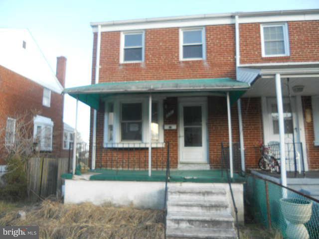 1931 Quentin Road Baltimore, MD 21222 - Photo 1 of 13 a front view of a house with a yard