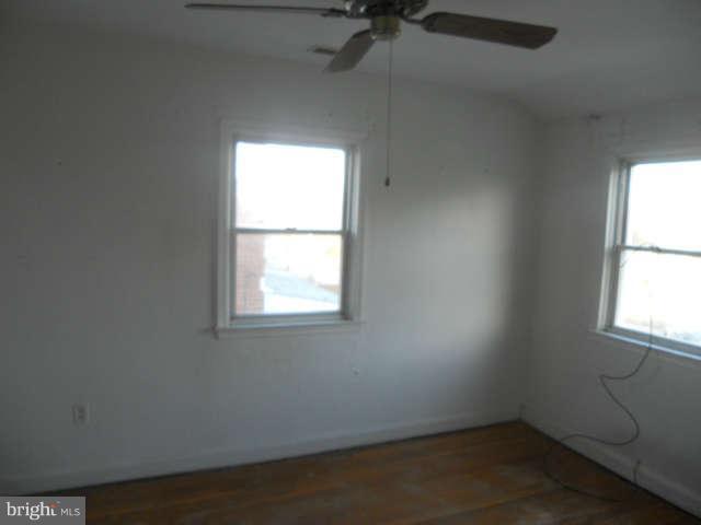 1931 Quentin Road Baltimore, MD 21222 - Photo 10 of 13 an empty room with a window