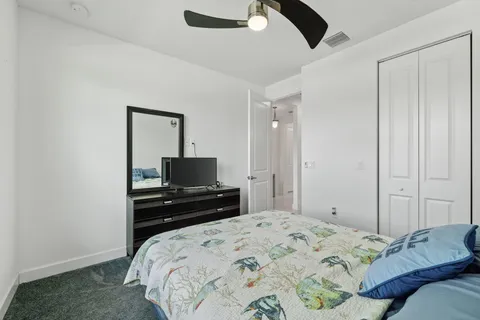 a bedroom with a bed and a television