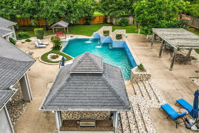 an aerial view of a house with a garden