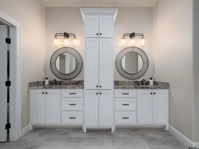 a living room with furniture and a walk in closet