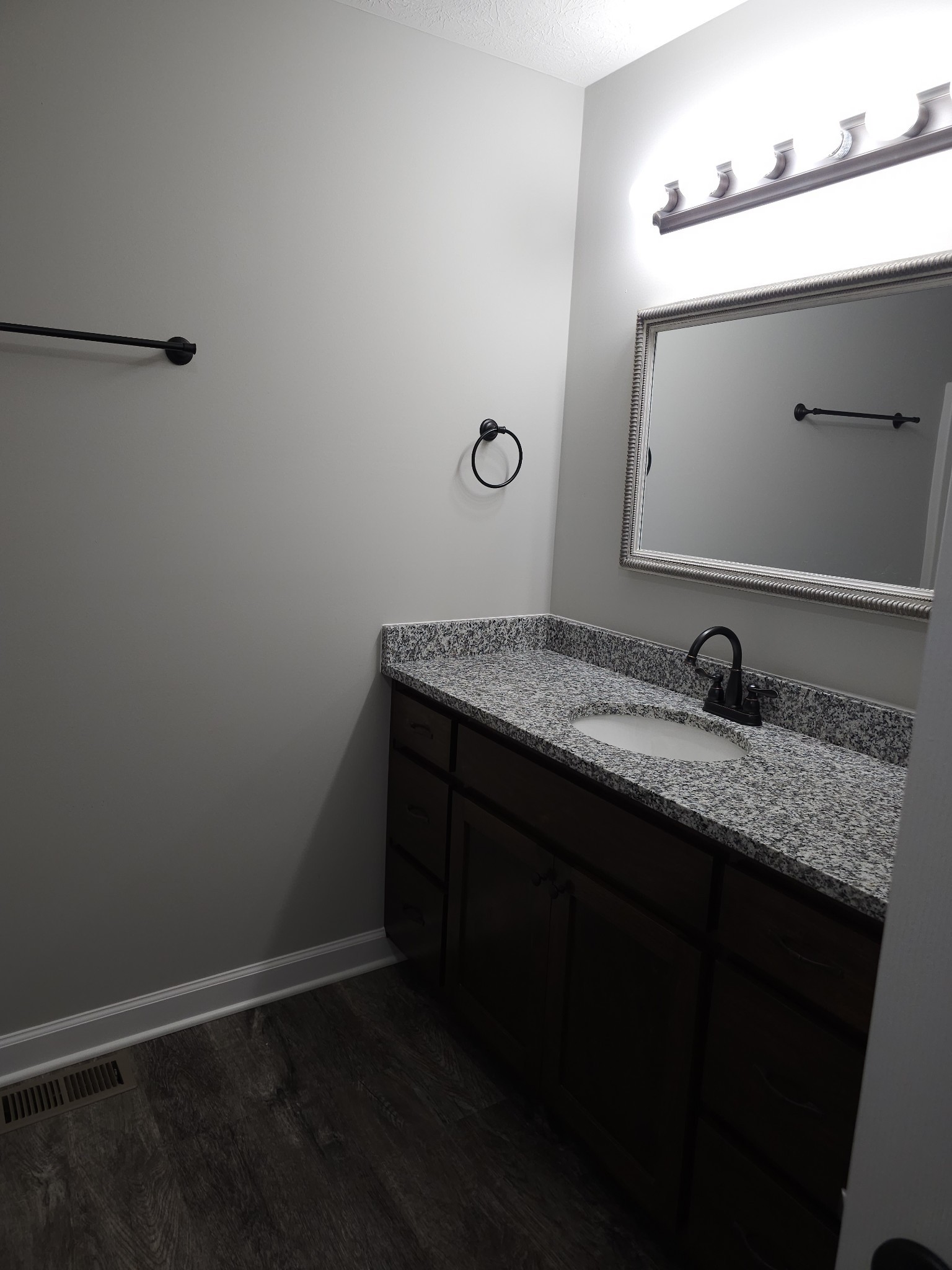 4020 Hartsville Road Lafayette, TN 37083 - Photo 12 of 19 a bathroom with a granite countertop sink and a mirror