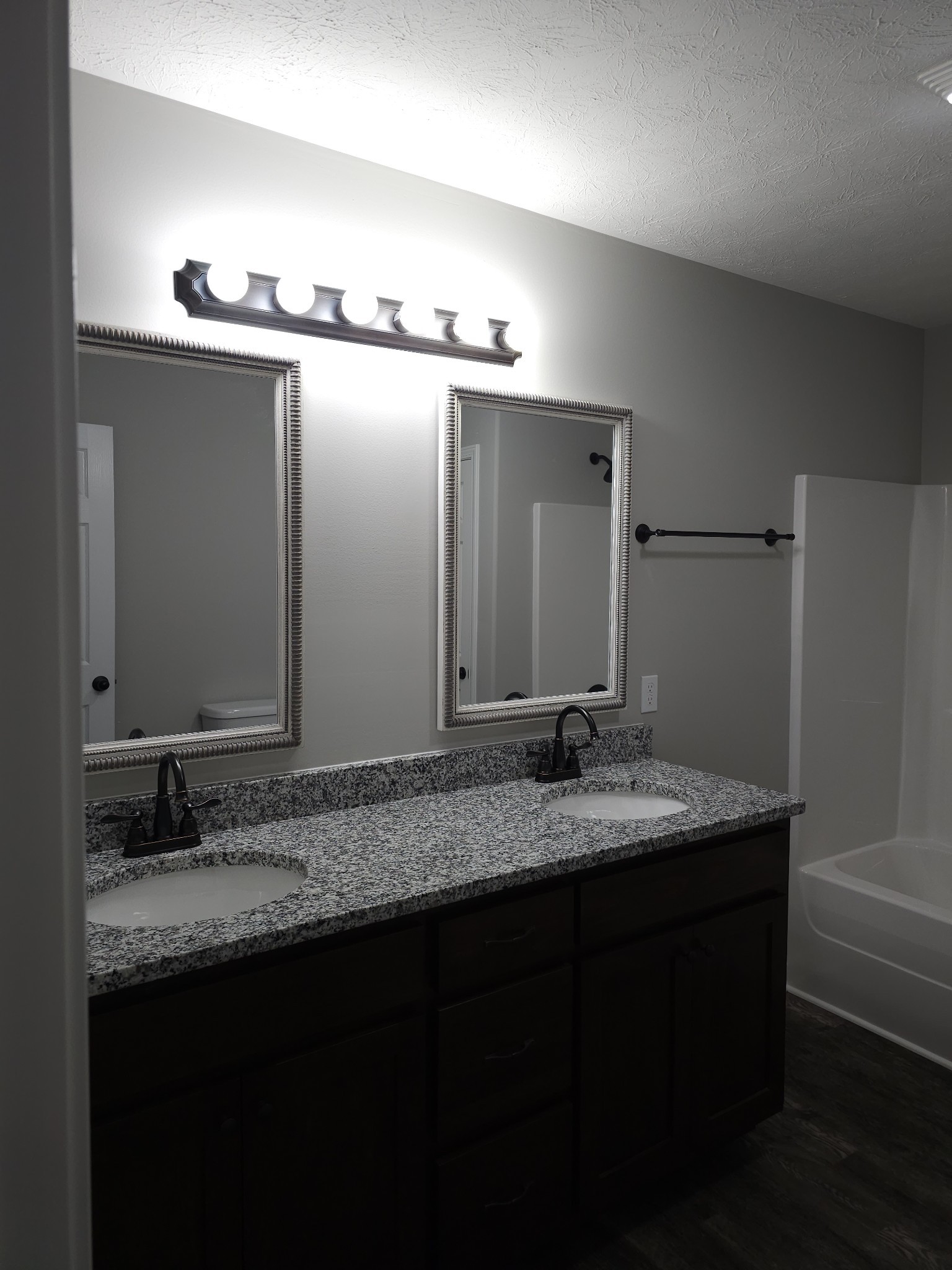 4020 Hartsville Road Lafayette, TN 37083 - Photo 8 of 19 a bathroom with a granite countertop sink and a mirror