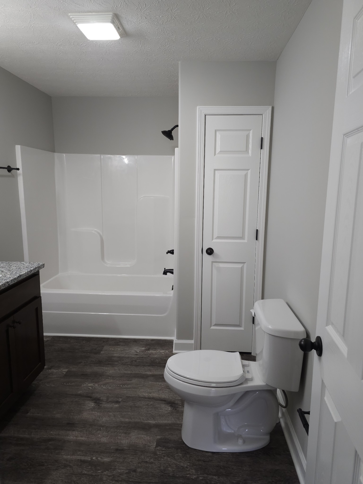 4020 Hartsville Road Lafayette, TN 37083 - Photo 9 of 19 a bathroom with a toilet and a bath tub
