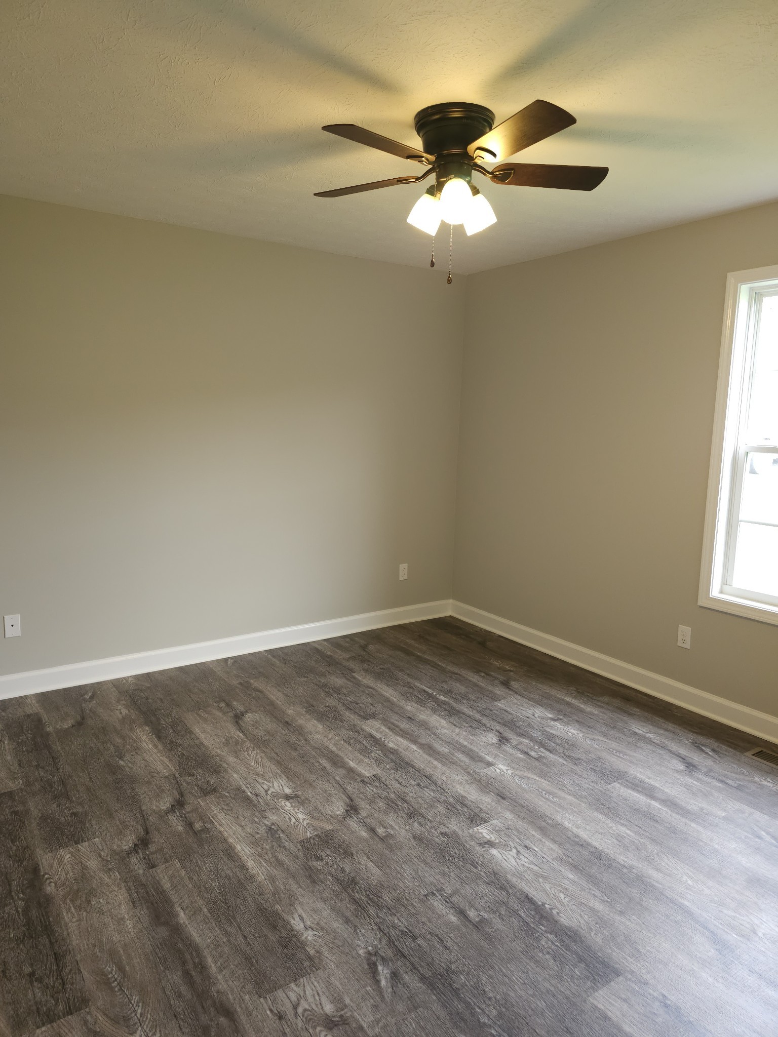 4020 Hartsville Road Lafayette, TN 37083 - Photo 10 of 19 wooden floor in an empty room with a window