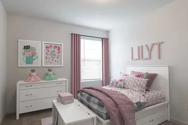 a bedroom with a bed and a cabinet