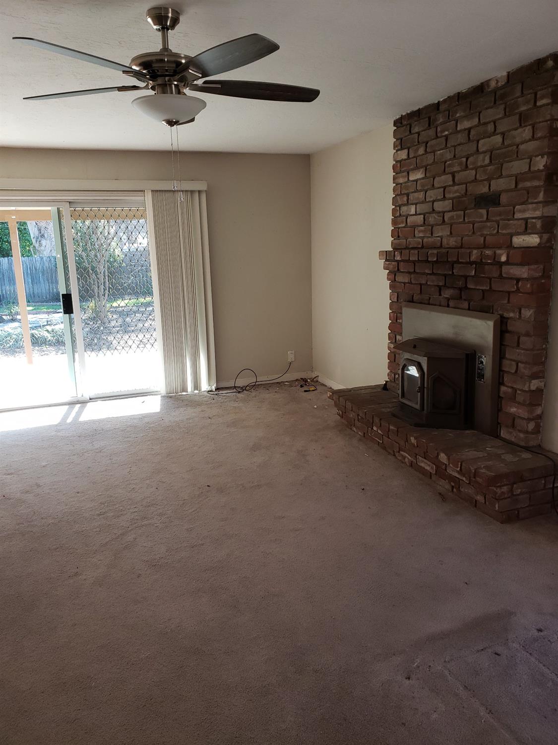 5516-5518 Engle Road Carmichael, CA 95608 - Photo 4 of 9 a view of an empty room with a fireplace