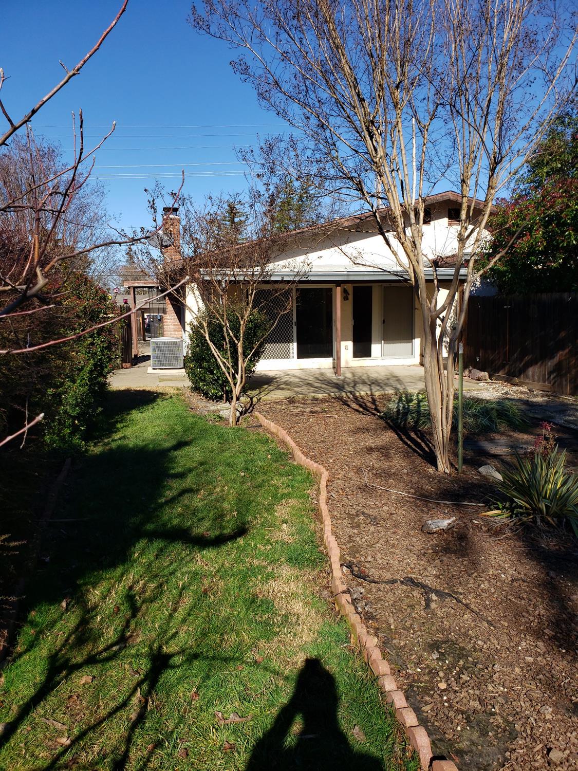 5516-5518 Engle Road Carmichael, CA 95608 - Photo 7 of 9 a front view of a house with garden