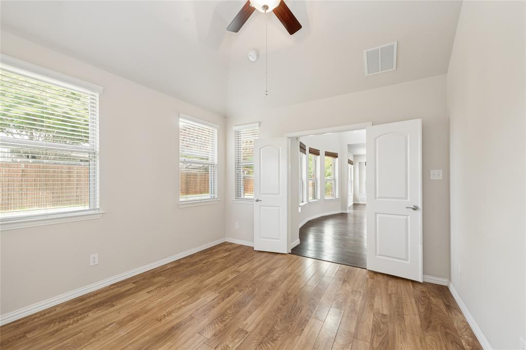 12571 Valley Spring Drive Frisco, TX 75035 - Photo 17 of 39 a view of empty room with wooden floor and window