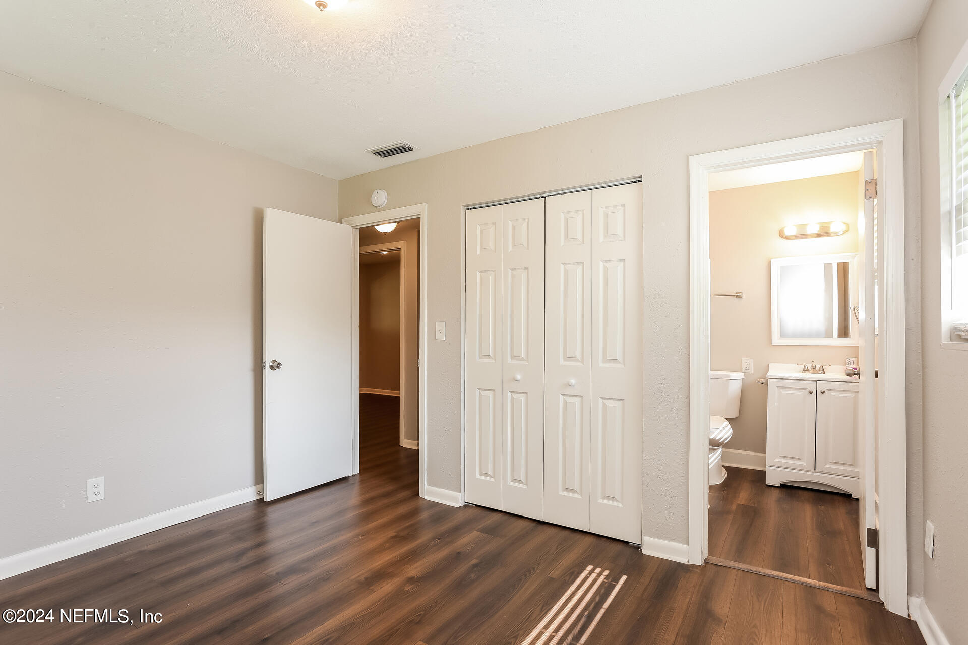 7003 Rollo Road Jacksonville, FL 32205 - Photo 14 of 21 a view of empty room with wooden floor