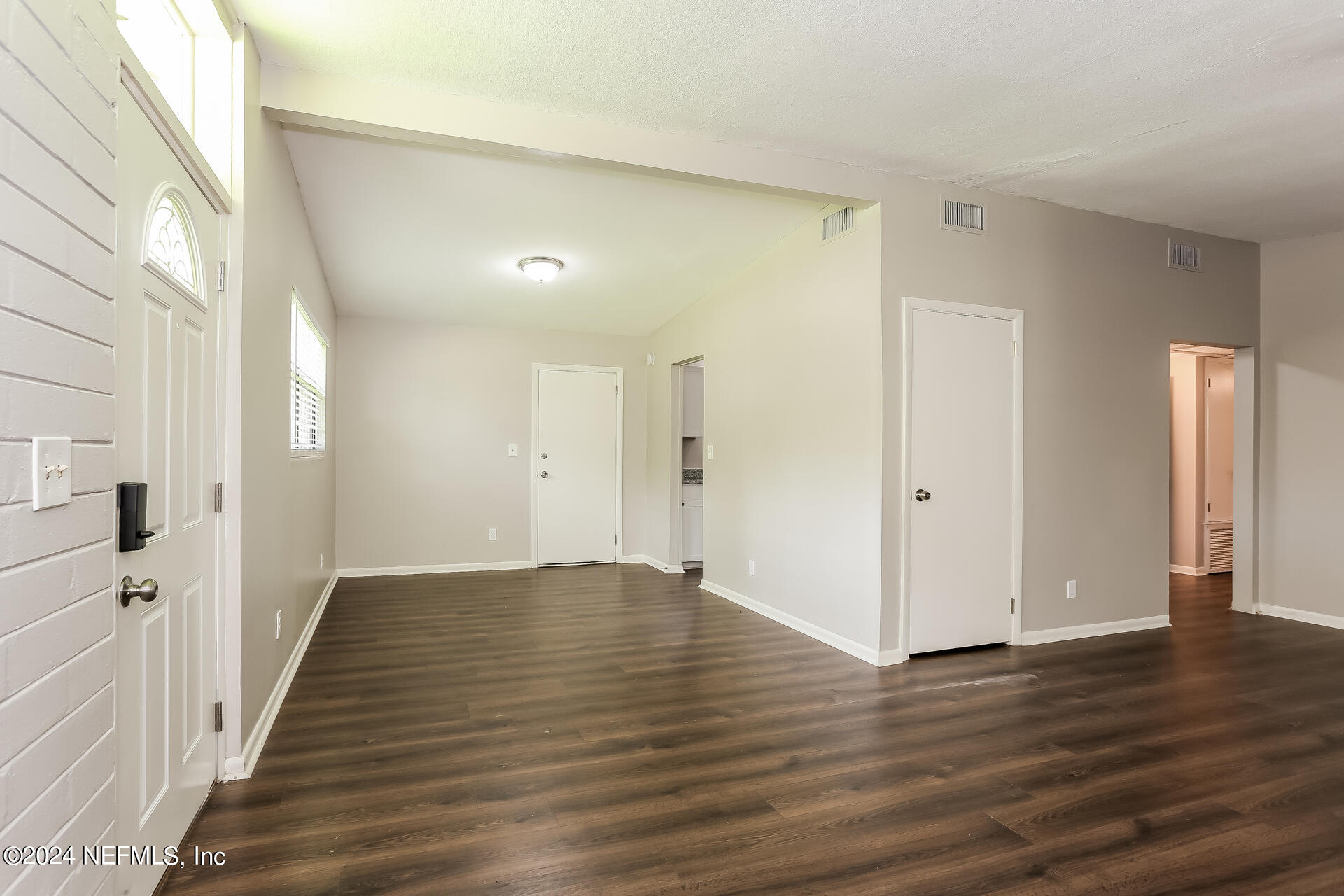 7003 Rollo Road Jacksonville, FL 32205 - Photo 4 of 21 a view of a hallway with wooden floor