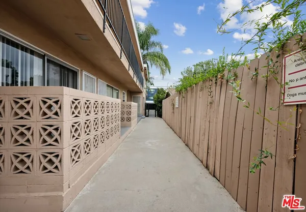 a view of a house with wooden stairs