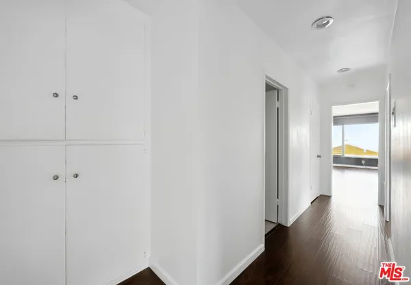 a hallway with wooden floor
