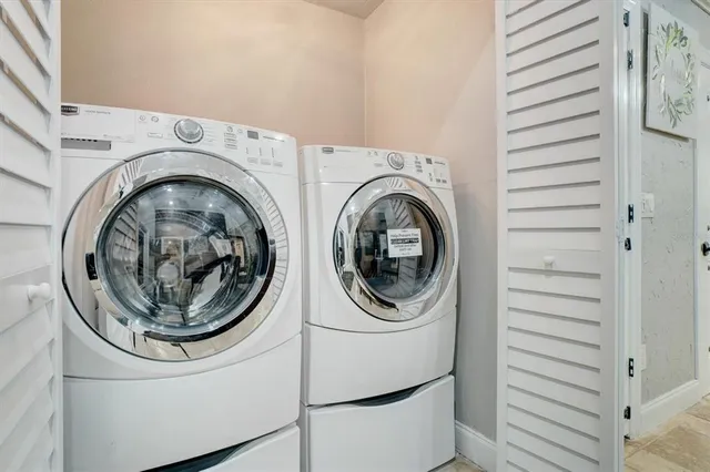 a utility room with dryer and washer