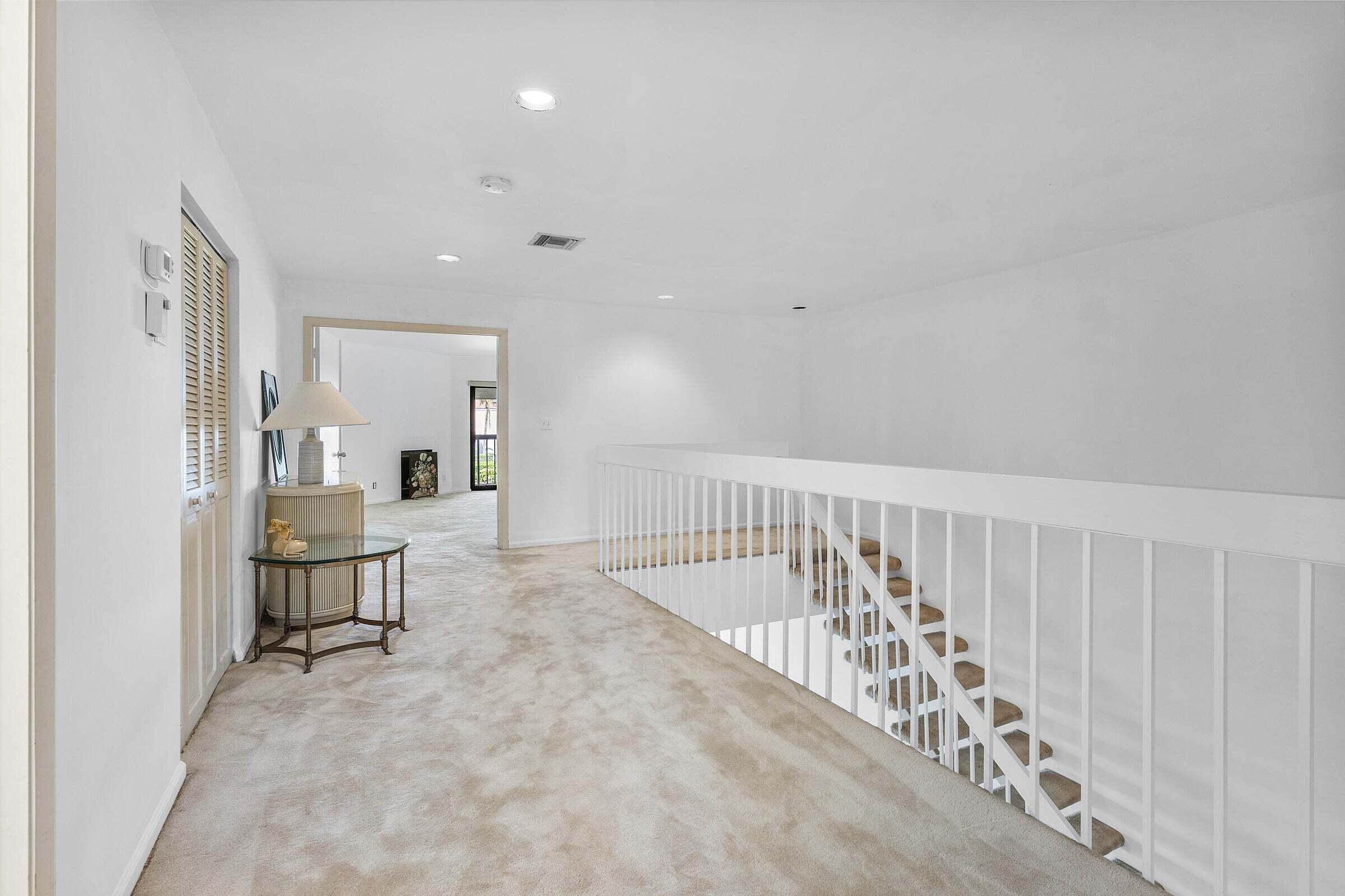 6711 North Ocean Boulevard, Unit 13 Ocean Ridge, FL 33435 - Photo 19 of 50 a view of a hallway with seating area