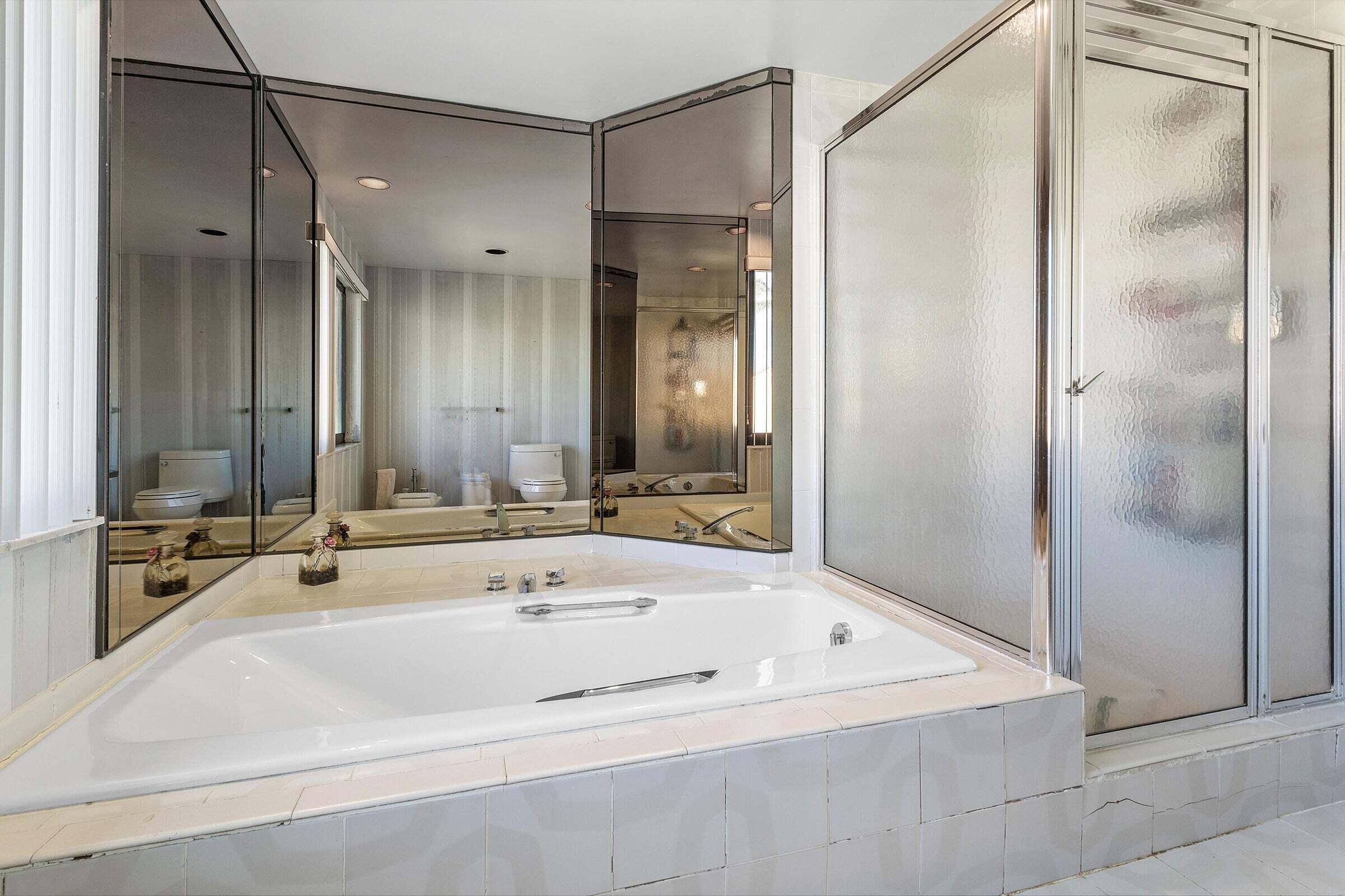 6711 North Ocean Boulevard, Unit 13 Ocean Ridge, FL 33435 - Photo 26 of 50 a bathroom with a bathtub and a sink