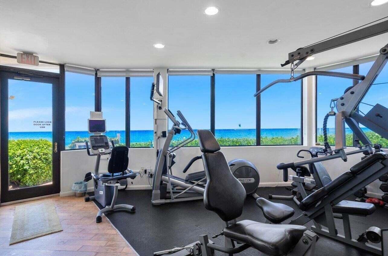 6711 North Ocean Boulevard, Unit 13 Ocean Ridge, FL 33435 - Photo 43 of 50 a view of a livingroom with furniture and a window