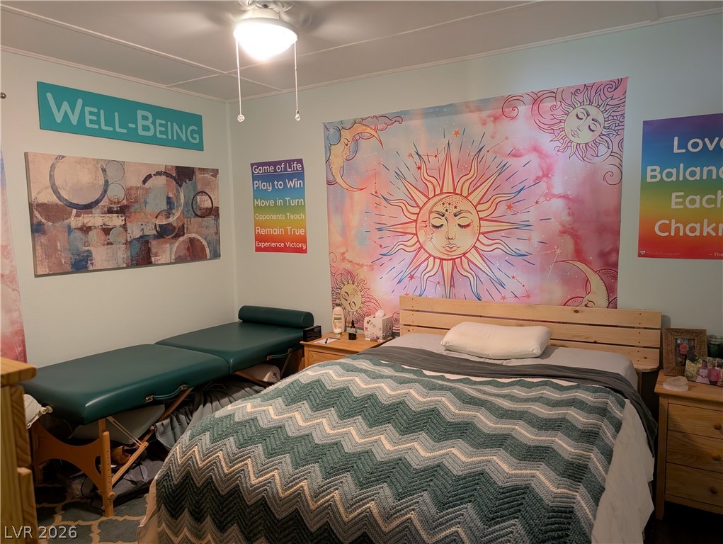 102 Rowan Drive Caliente, NV 89008 - Photo 12 of 28 A comforting retreat provides a bed and a therapeutic massage table for ultimate relaxation.