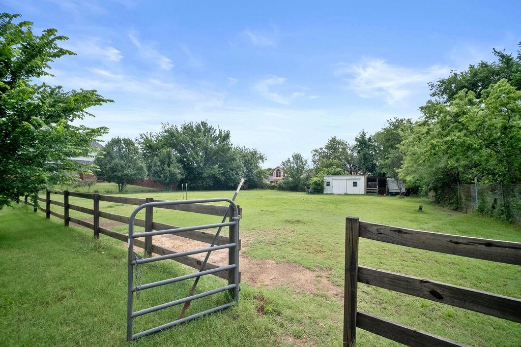 6939 Calender Road Arlington, TX 76001 - Photo 16 of 40 View of yard featuring an outbuilding and a rural view