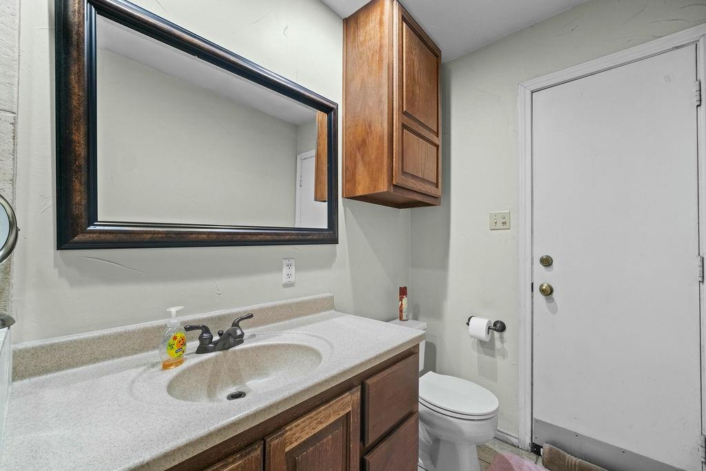 6939 Calender Road Arlington, TX 76001 - Photo 27 of 40 Bathroom featuring vanity and toilet