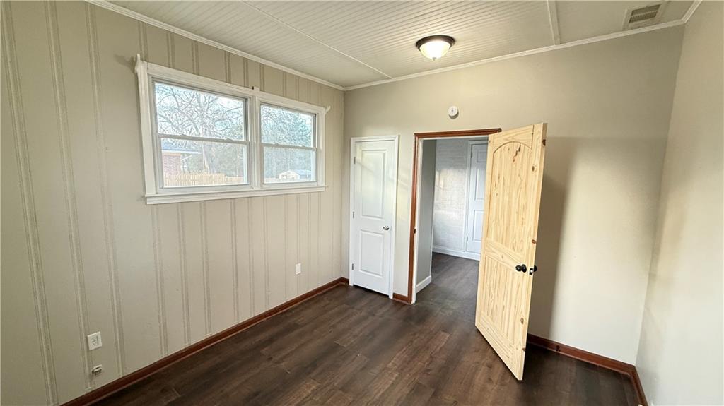 43 Bell Street Hartwell, GA 30643 - Photo 11 of 15 a view of an empty room with wooden floor and a window