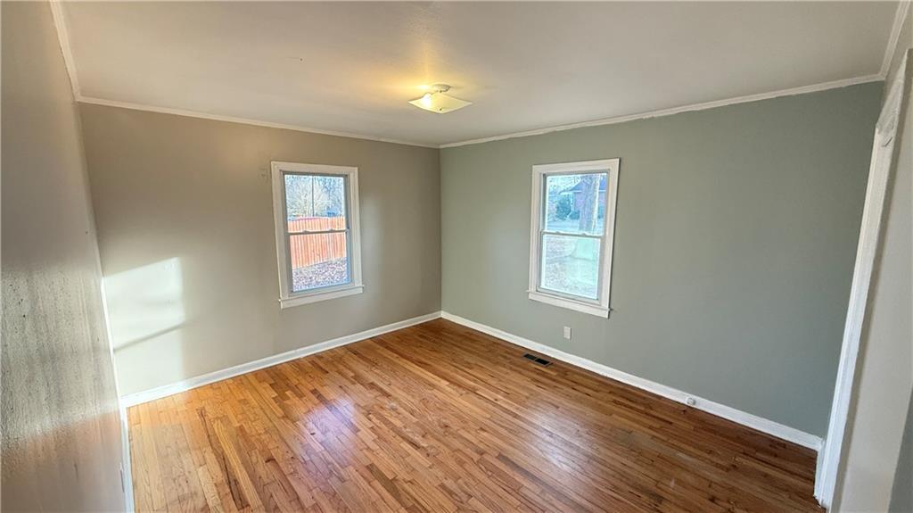 43 Bell Street Hartwell, GA 30643 - Photo 13 of 15 a view of empty room with wooden floor and fan