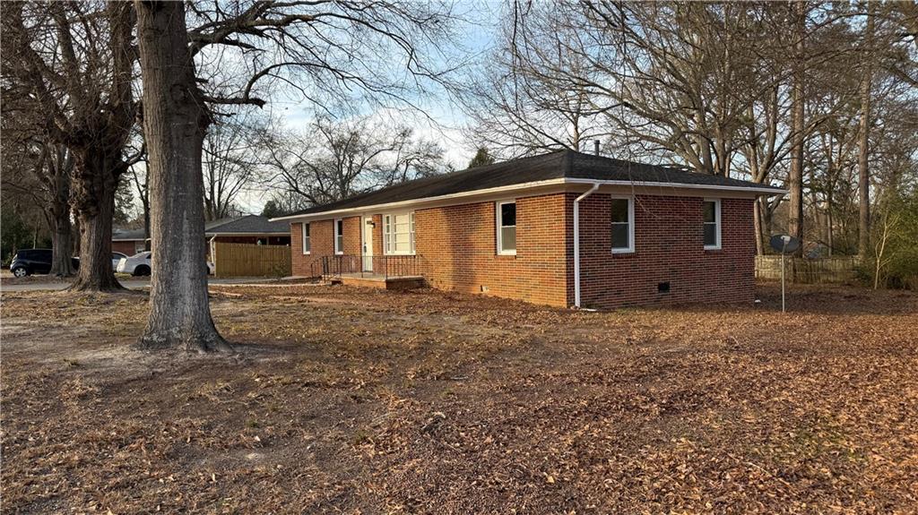 43 Bell Street Hartwell, GA 30643 - Photo 2 of 15 a view of a house with a yard and large tree