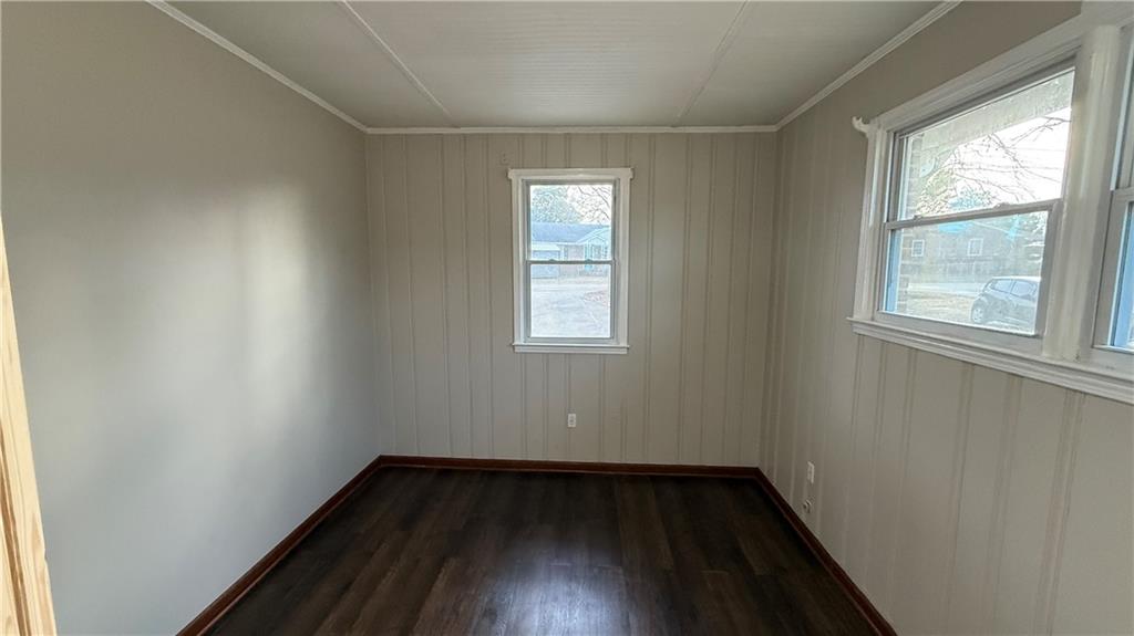 43 Bell Street Hartwell, GA 30643 - Photo 10 of 15 an empty room with wooden floor and windows