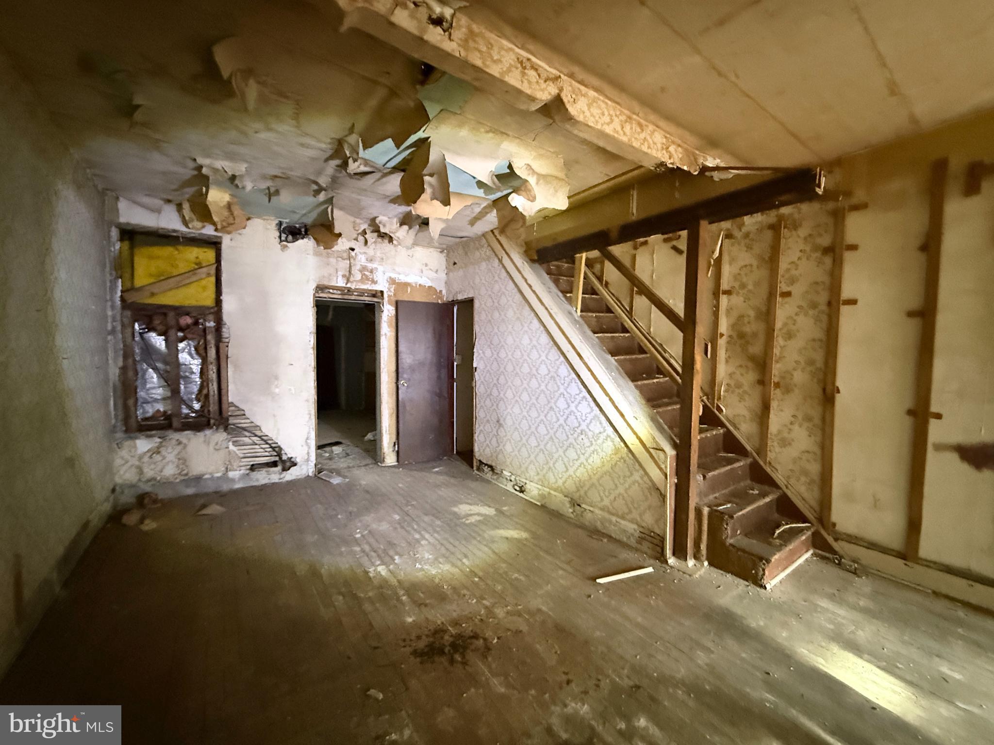 6327 Wheeler Street Philadelphia, PA 19142 - Photo 14 of 36 a view of a room with stairs and a window