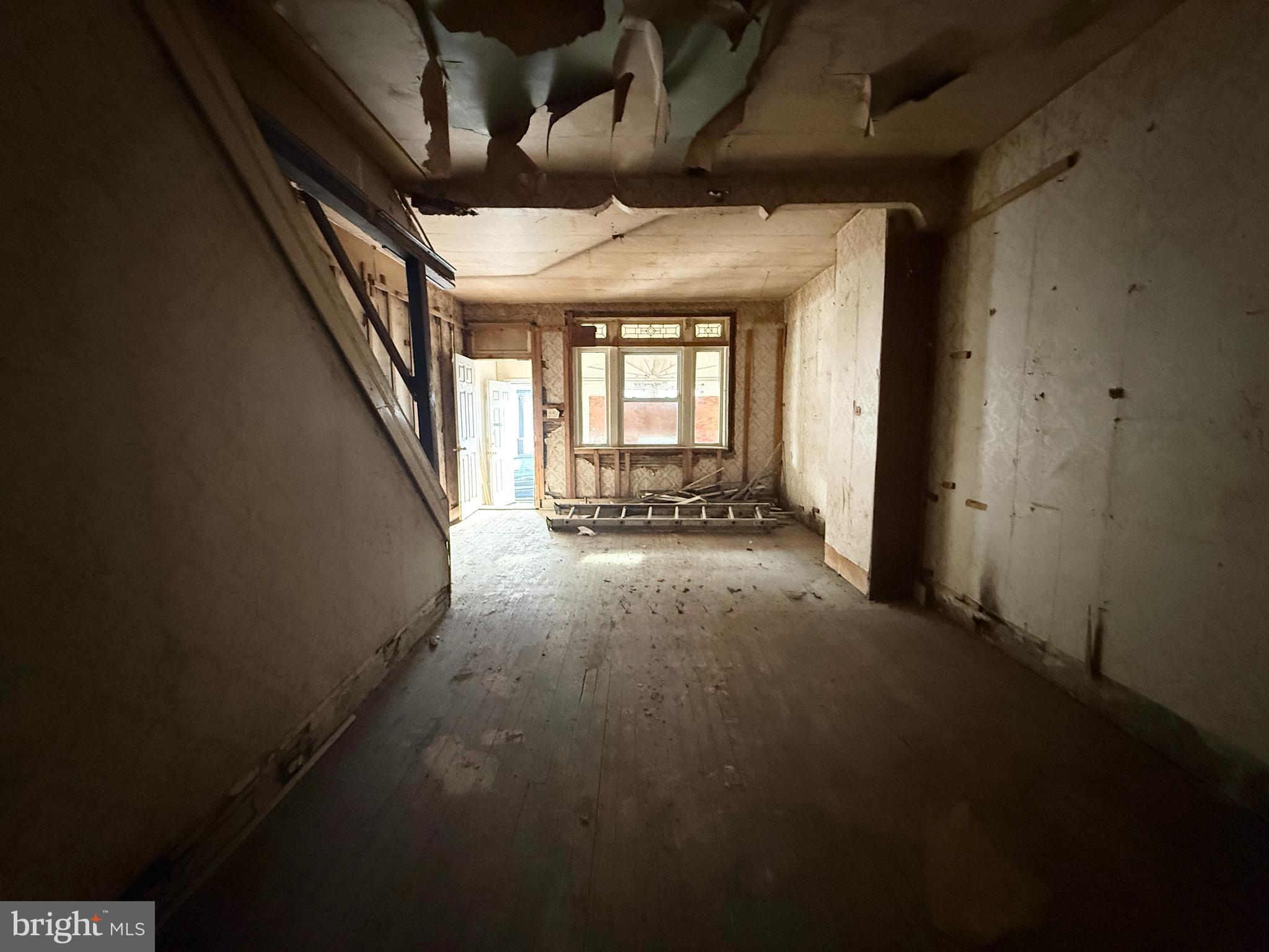 6327 Wheeler Street Philadelphia, PA 19142 - Photo 17 of 36 wooden floor in an empty room with a window