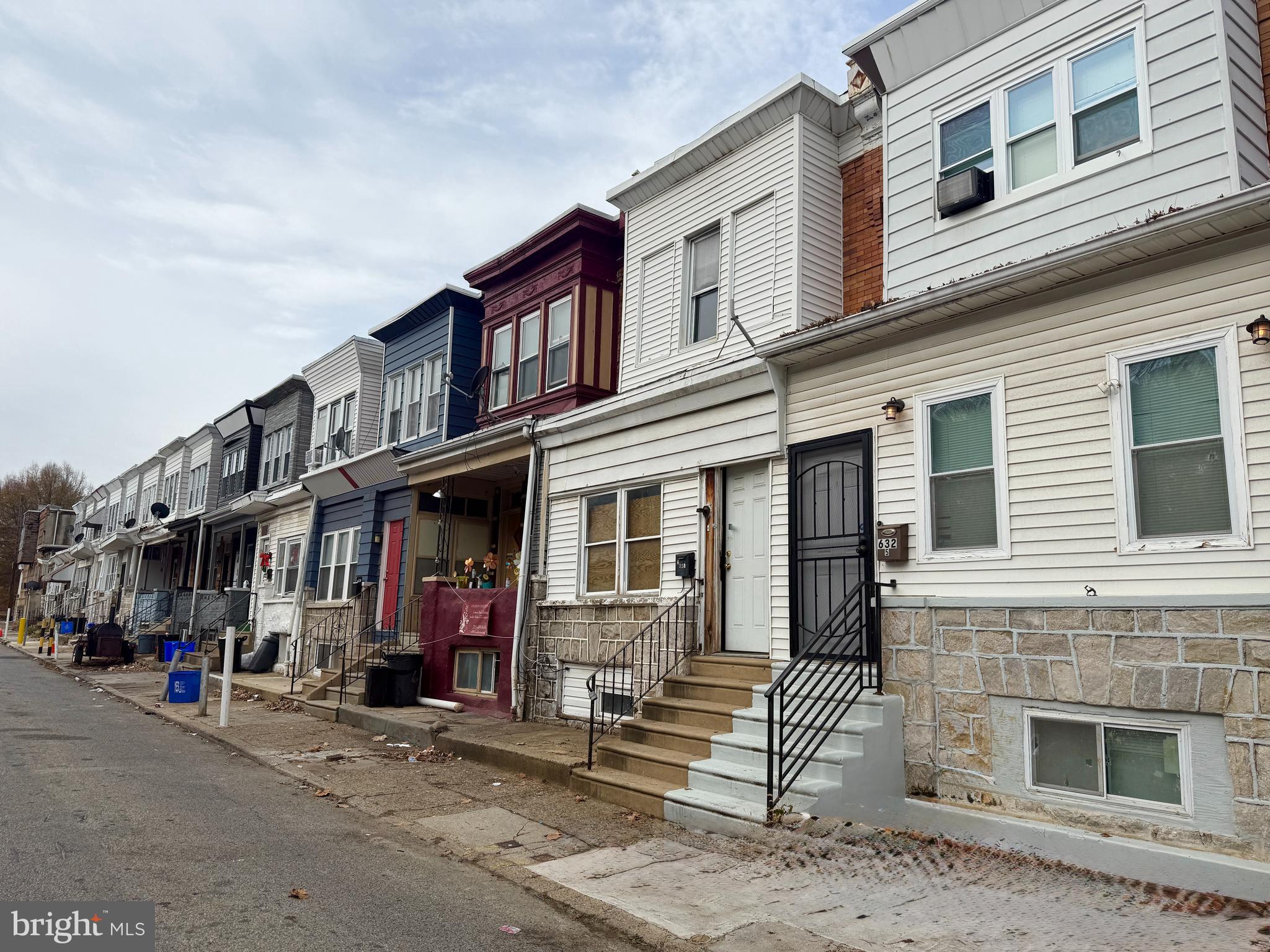 6327 Wheeler Street Philadelphia, PA 19142 - Photo 5 of 36 a front view of a building with a garden