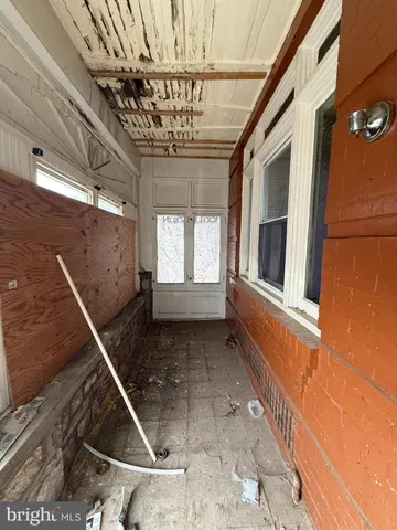 a view of entryway and hall with a window