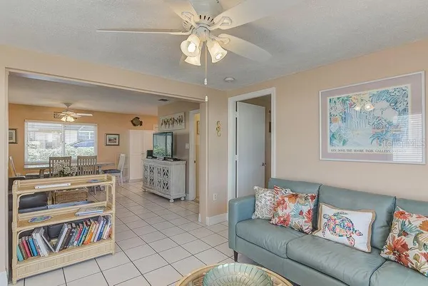a living room with furniture and a bookshelf