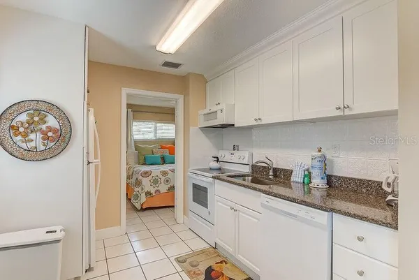 a kitchen with a cabinets and a stove