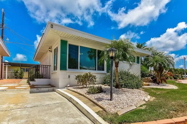 a view of house with patio outdoor seating and entertaining space