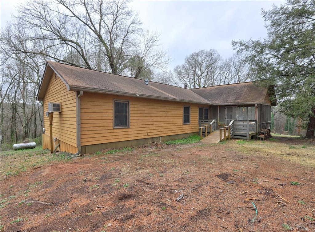3032 Lake Monroe Road Douglasville, GA 30135 - Photo 1 of 1 a view of a house with a yard and large tree