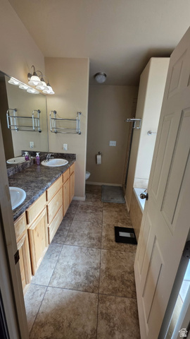 1330 North Dixie Downs Road, Unit 72 St. George, UT 84770 - Photo 10 of 21 Bathroom with double vanity, a bath, a stall shower, and light tile patterned flooring