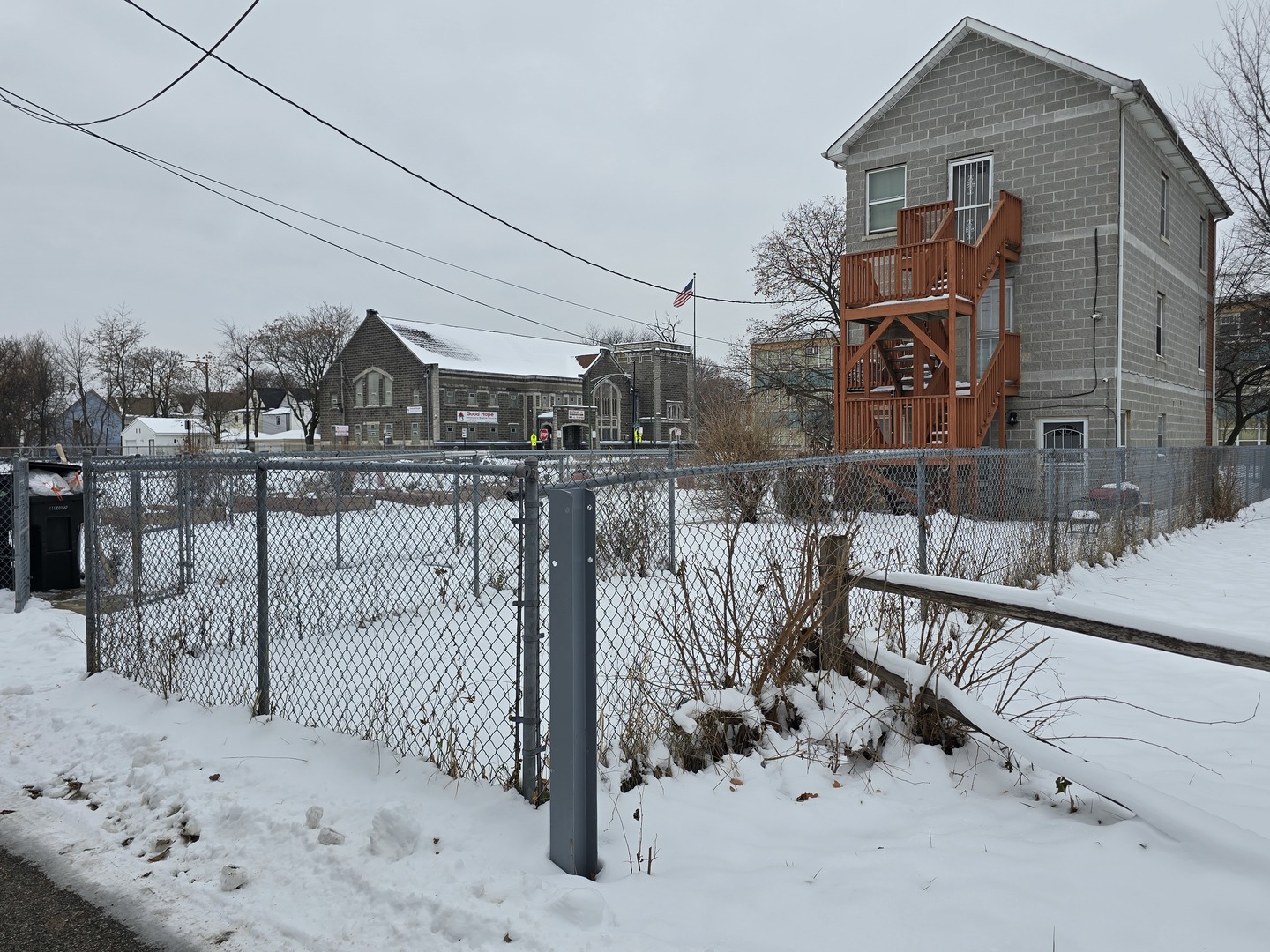 7047 South Lowe Avenue Chicago, IL 60621 - Photo 3 of 3 a view of a house with wooden fence