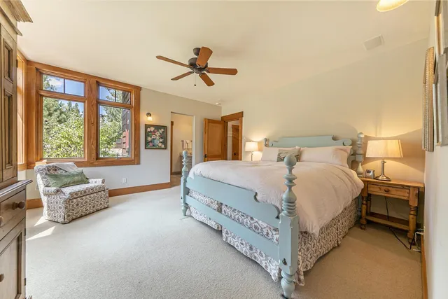 a spacious bedroom with a bed and a couch