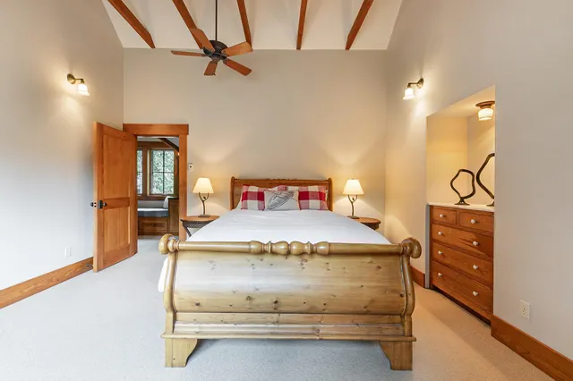 a bedroom with a bed and a table